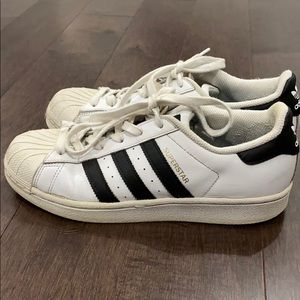 Adidas superstars with black stripes